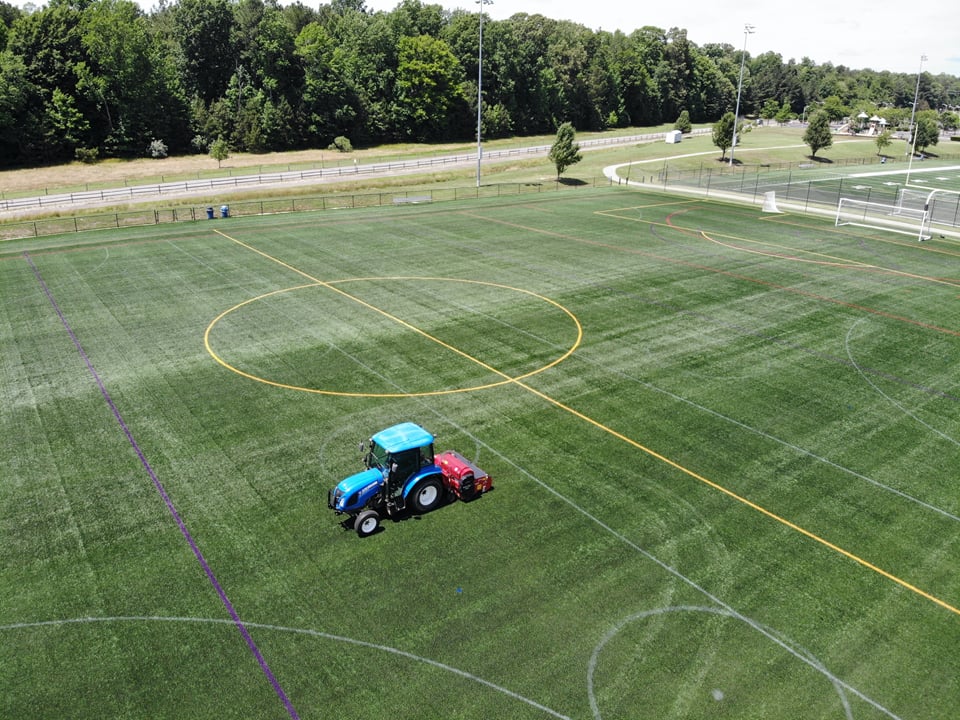 Artificial Turf maintenance being performed