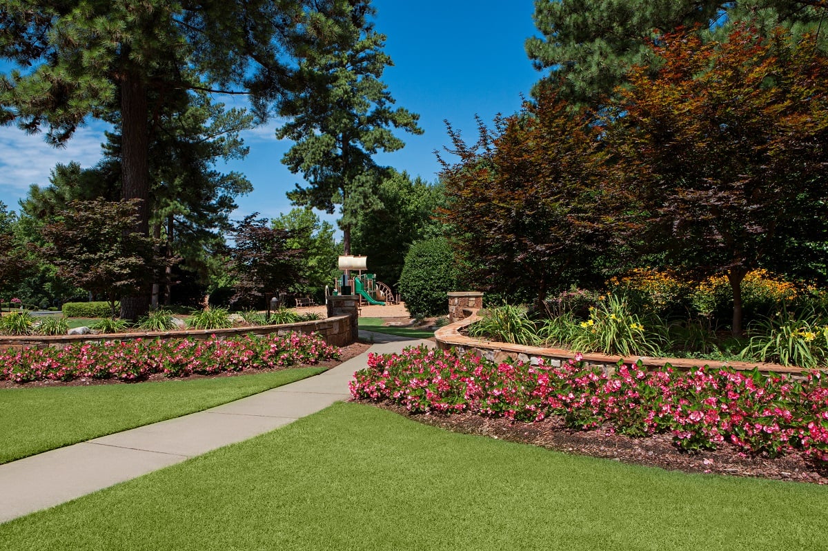 HOA property landscape with flowers and walkway