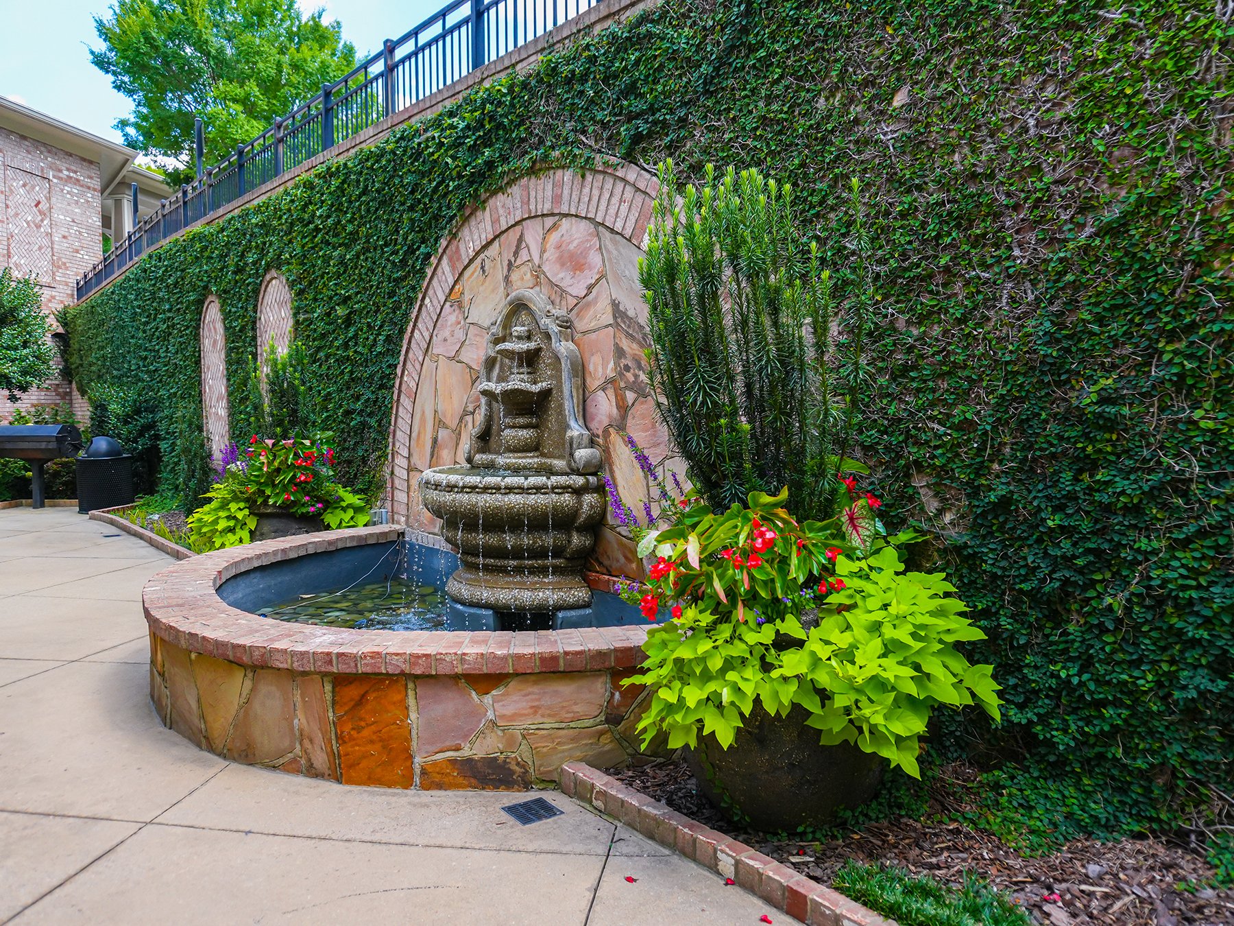 Water Fountain in front of Ivy wall