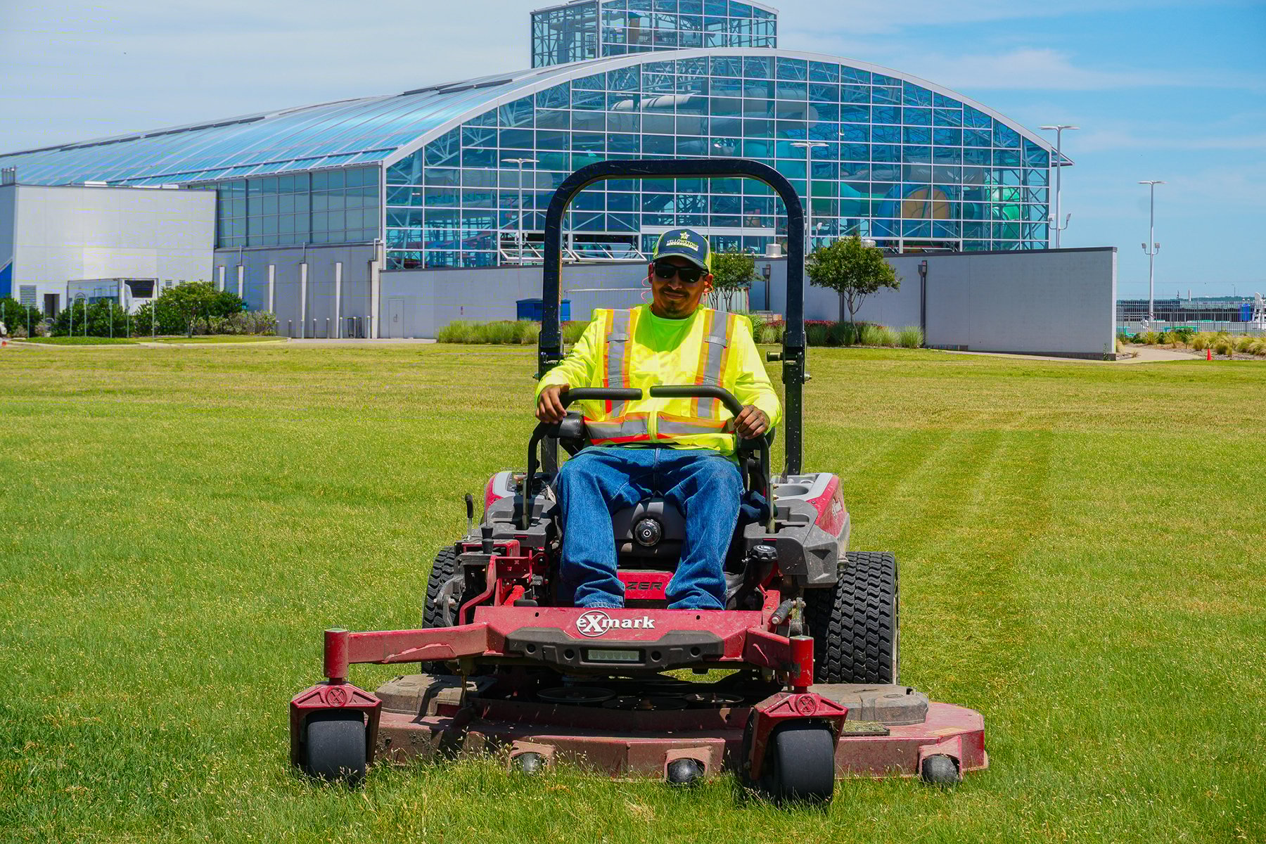 Mower in front of building | Landscaping in Forth Worth
