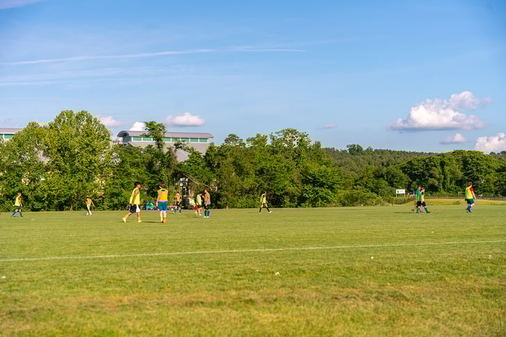 Students playing soccer | Sports Field Management Yellowstone Landscape 