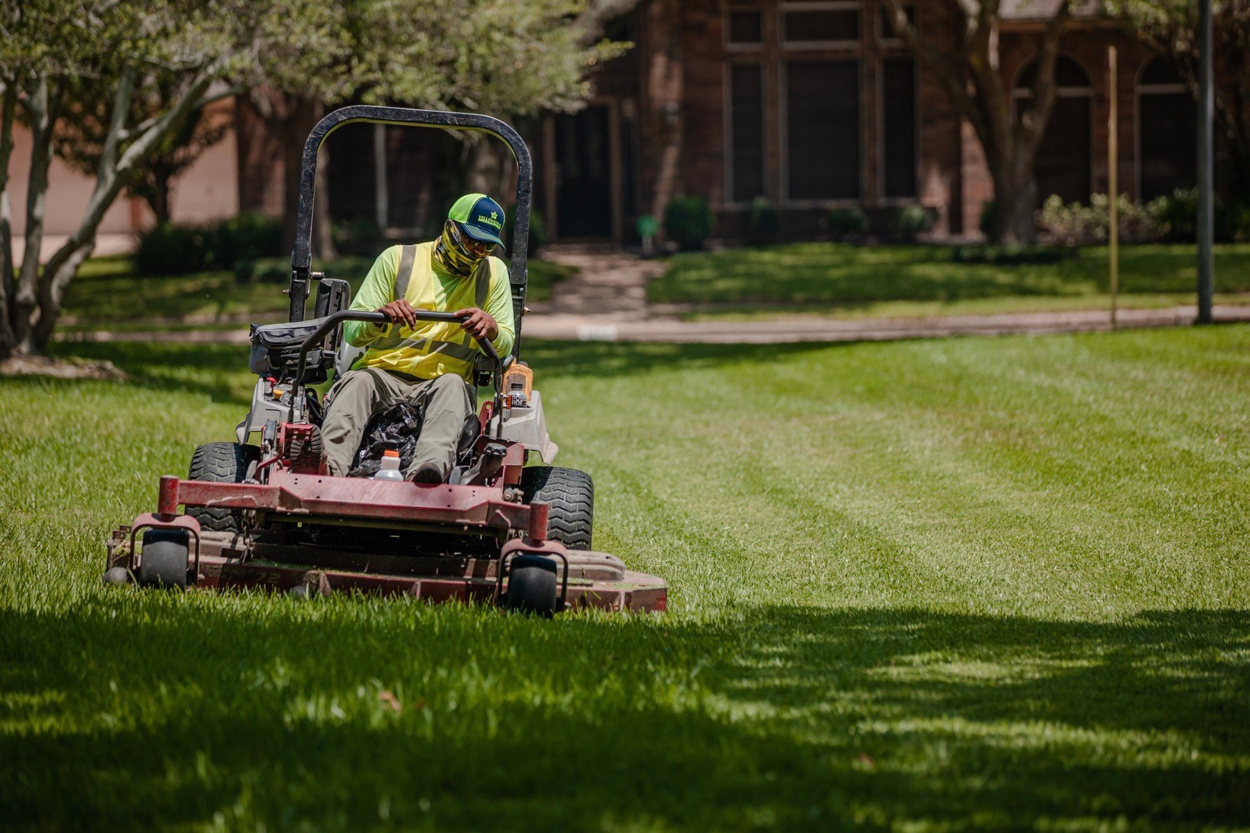 HOA landscaping team mowing