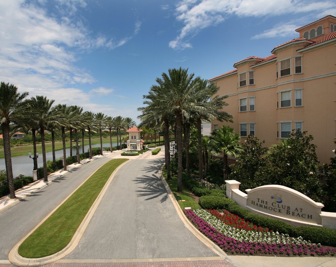 Hammock Beach Hotel entrance with lush green turf and annual flower plantings