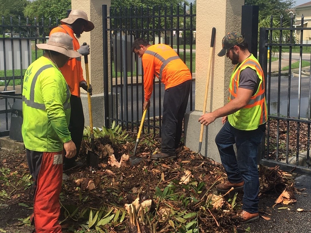 landscaper working at community association