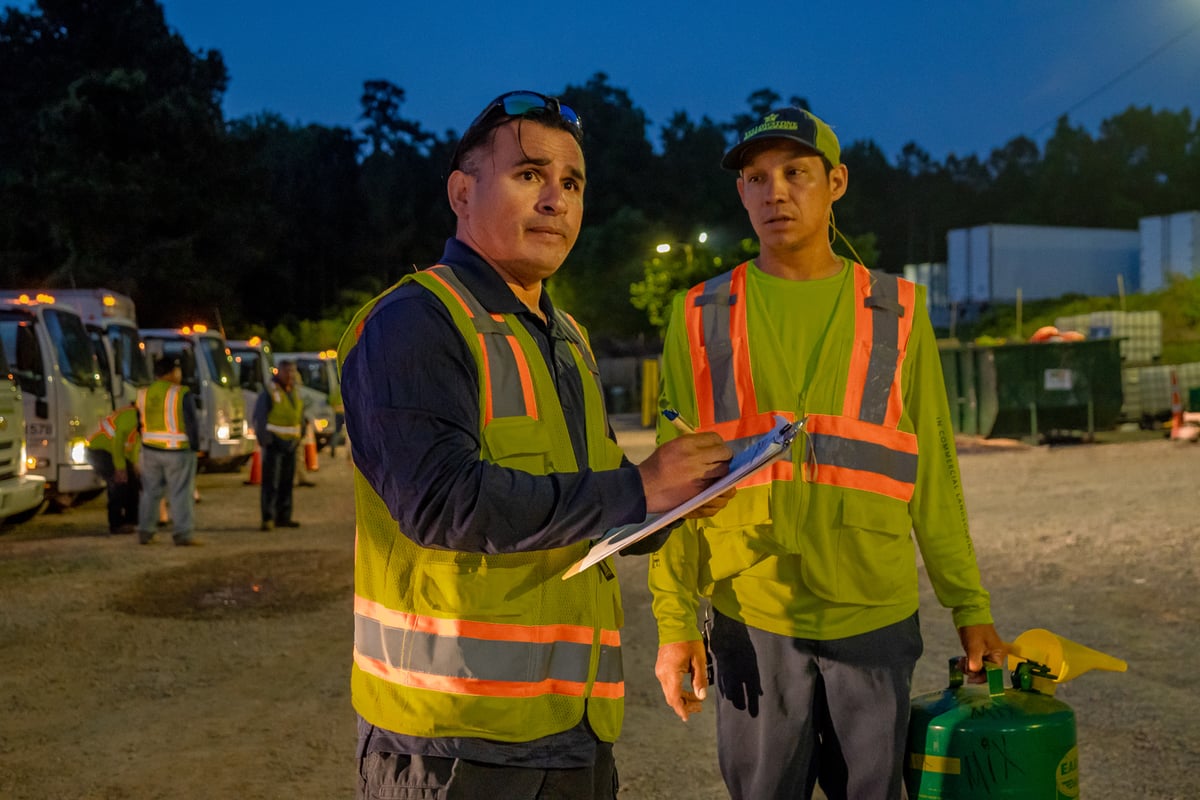 Commercial landscaping team leader meets with crew