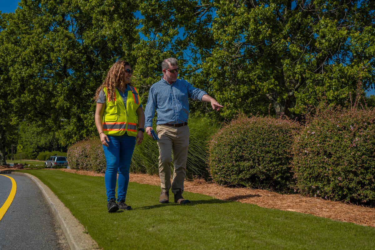 Commercial landscaping manager meets with clients