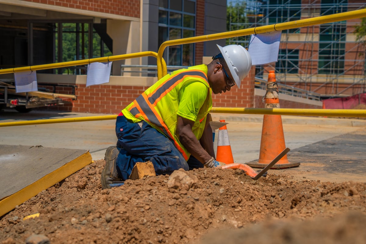 commercial landscaping company repairs broken irrigation line 