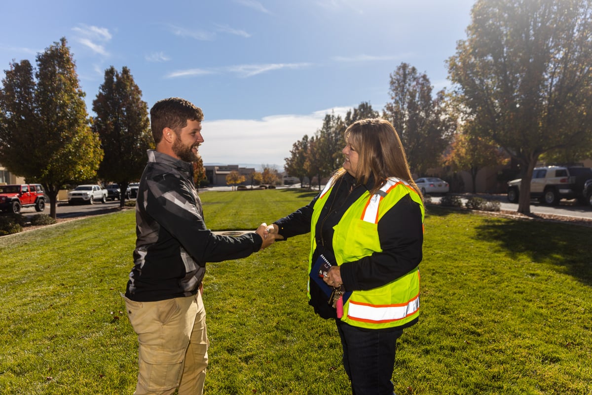 Client and account manager shaking hands