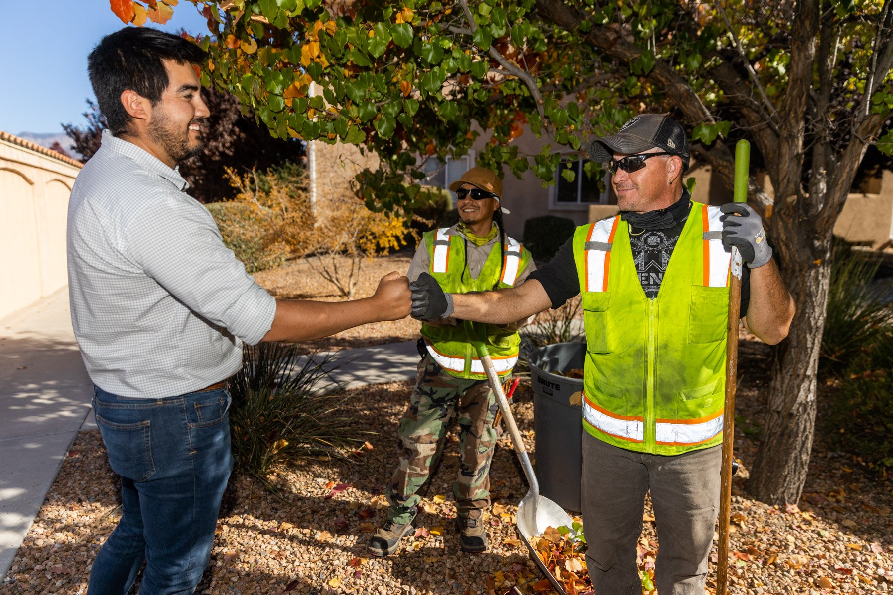 crew meeting with client on commercial landscaping property