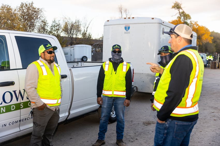 Crew talking by truck