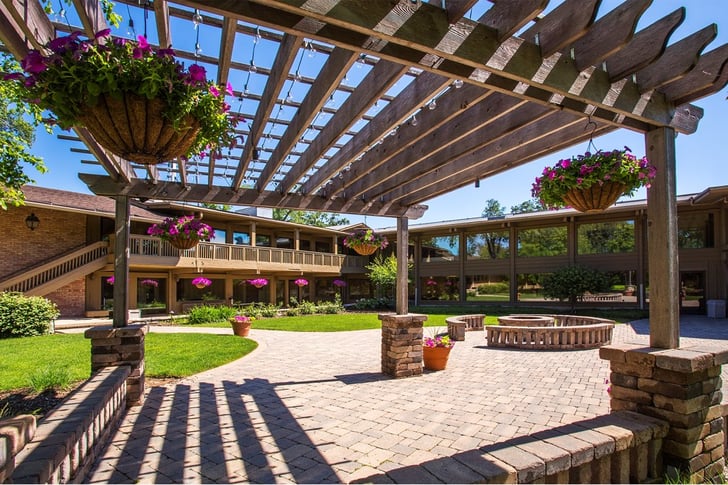 Up Close View of Pergola with Hanging Flower Baskets
