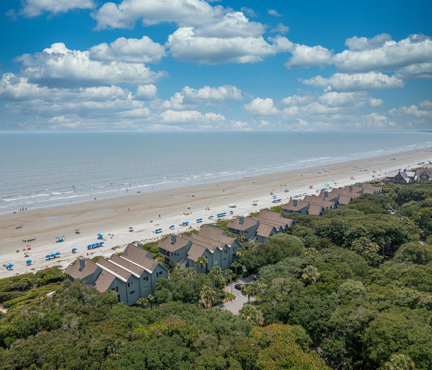 Aerial view of beach, landscaping, and homes at Mariner's Watch