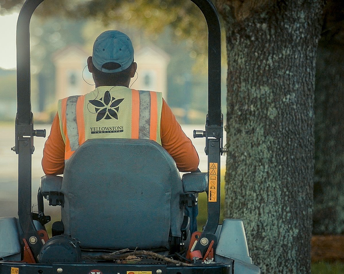 Yellowstone landscape employee working at community association landscape