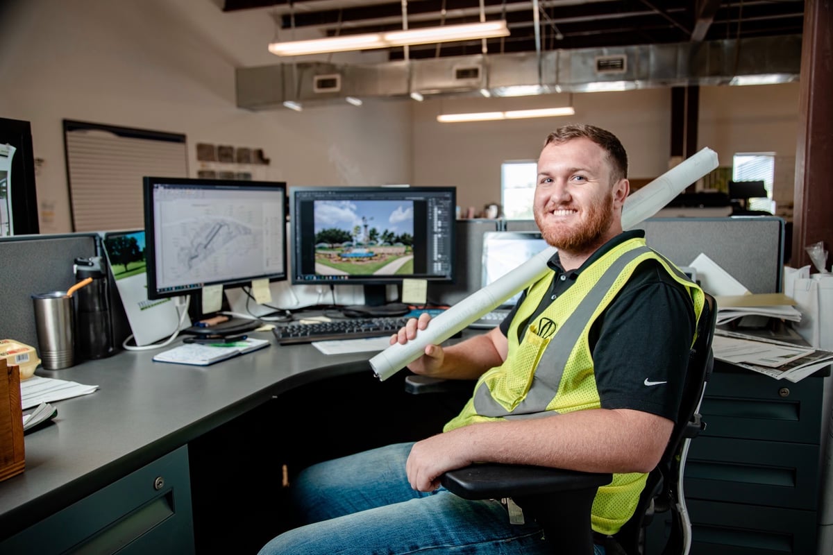 employee uses new software on computer