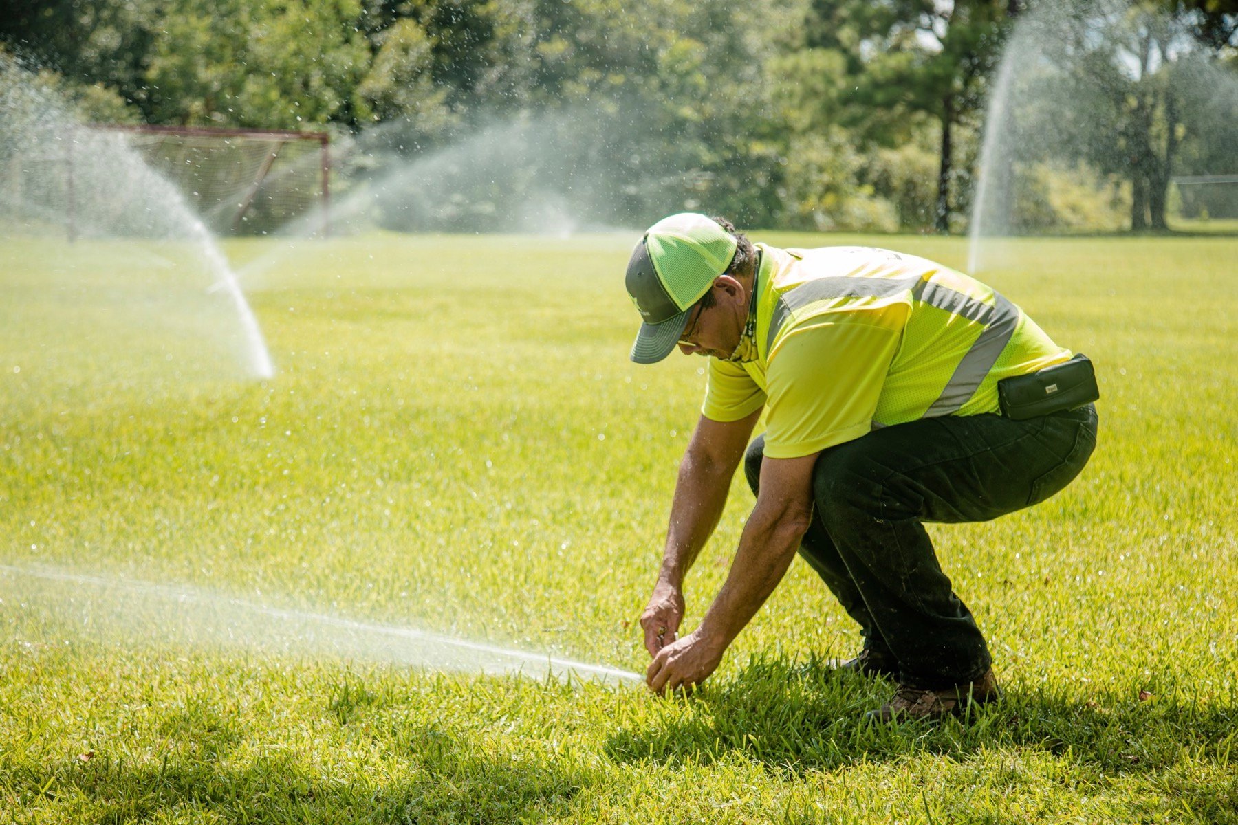 commercial irrigation crew inspecting sprinkler system