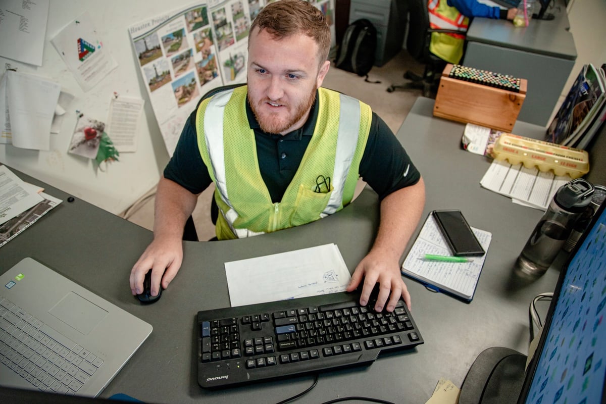 commercial landscape designer works on computer