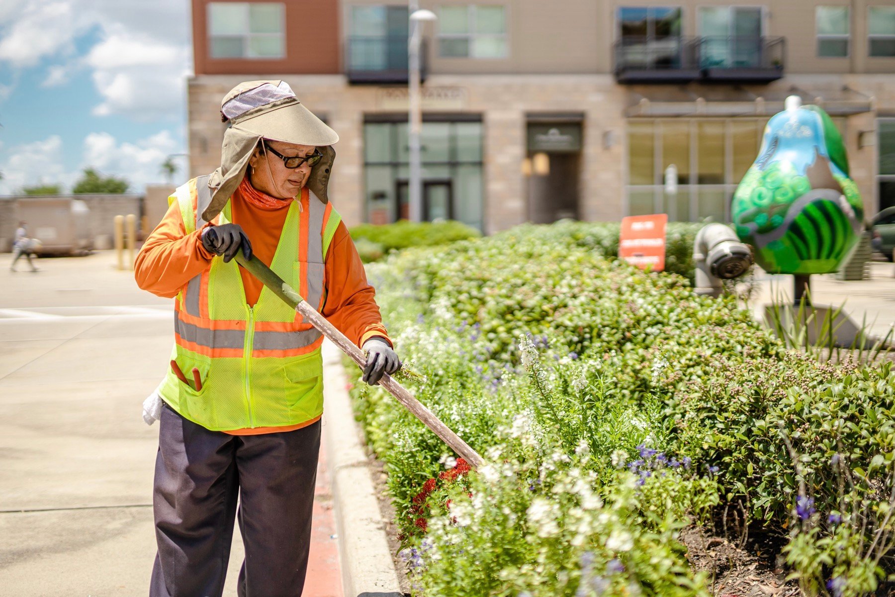 commercial landscape maintenance crew working sustainably