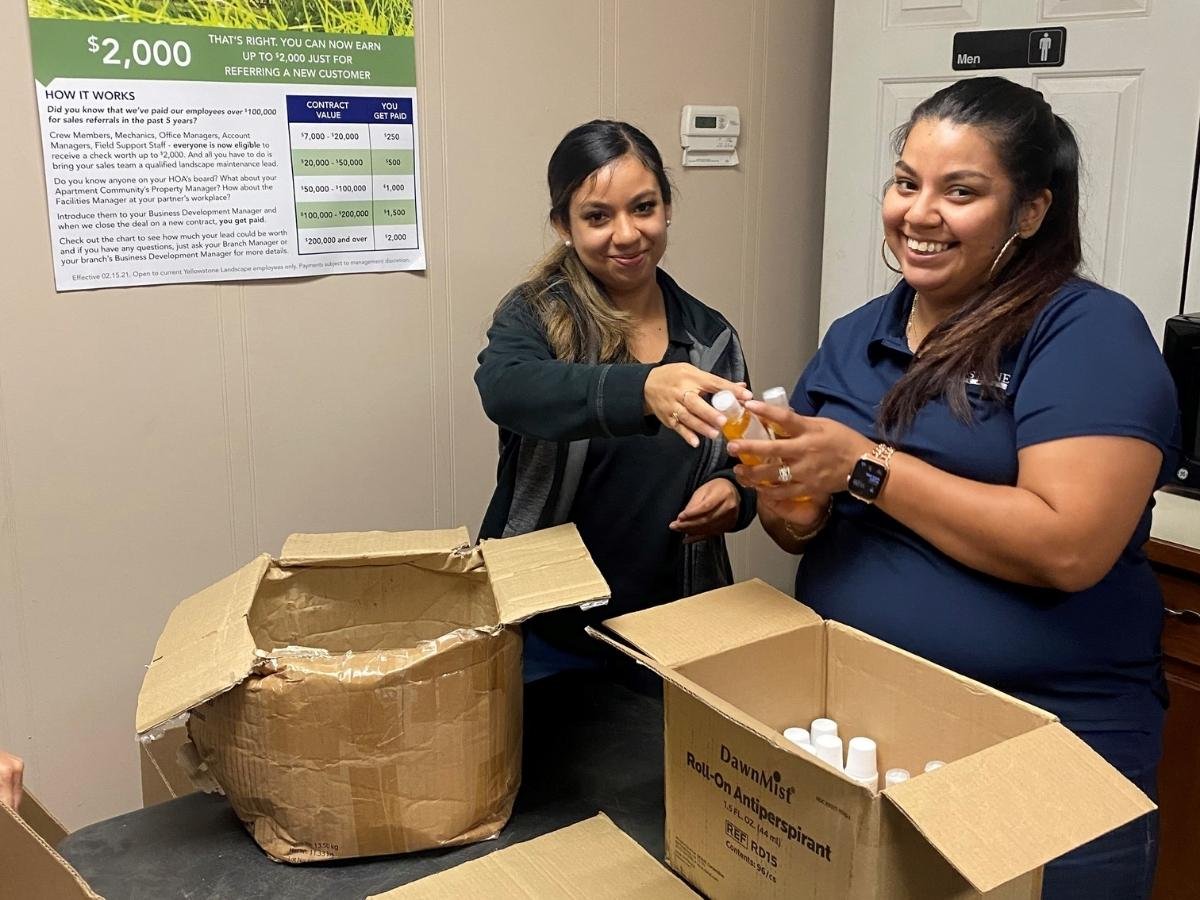 yellowstone landscaping employees packing kits for homeless