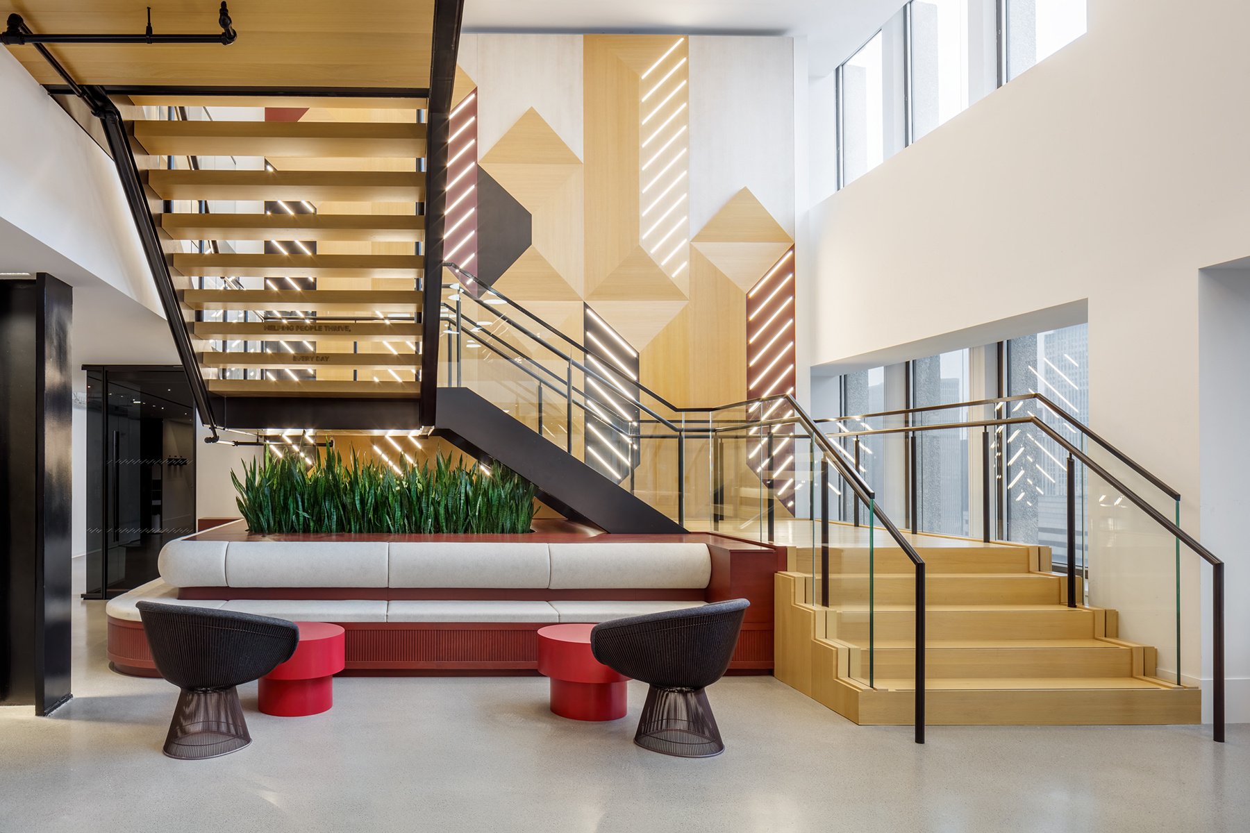 Biophilic design featuring large millwork plantings in a corporate office setting