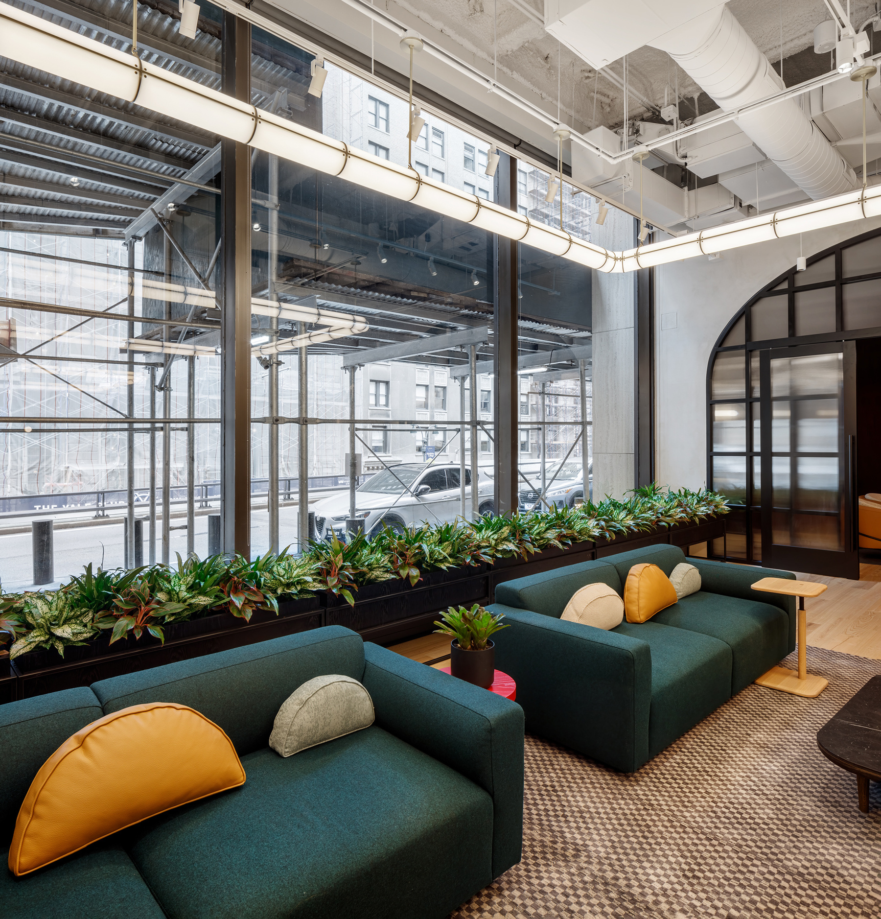 Lush greenery and custom planters enhancing the interior of a Manhattan accounting firm 