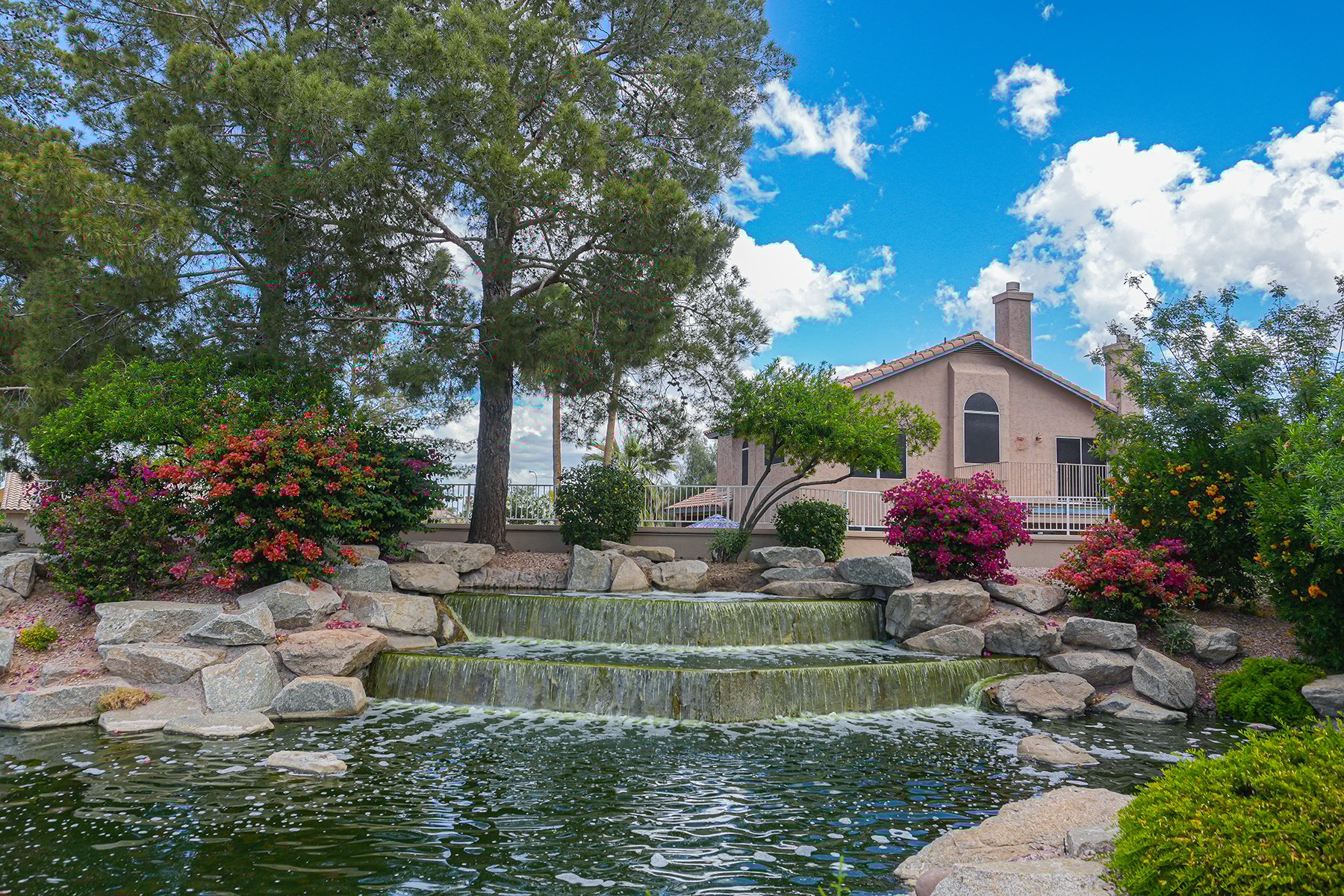 waterfall surrounded by flowers | Professional HOA Landscaping Services 