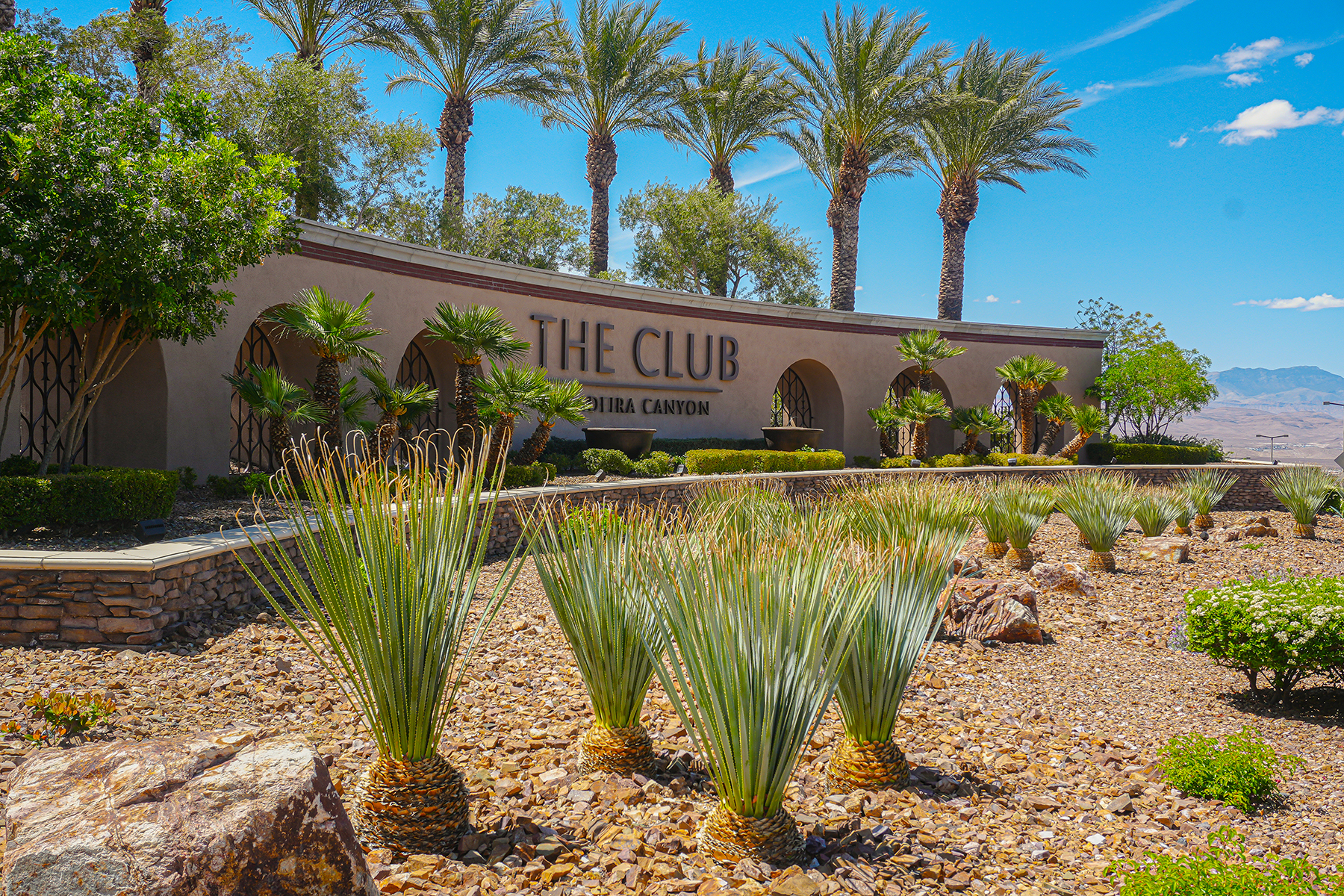 pineapple plants in front of entrance sign 
