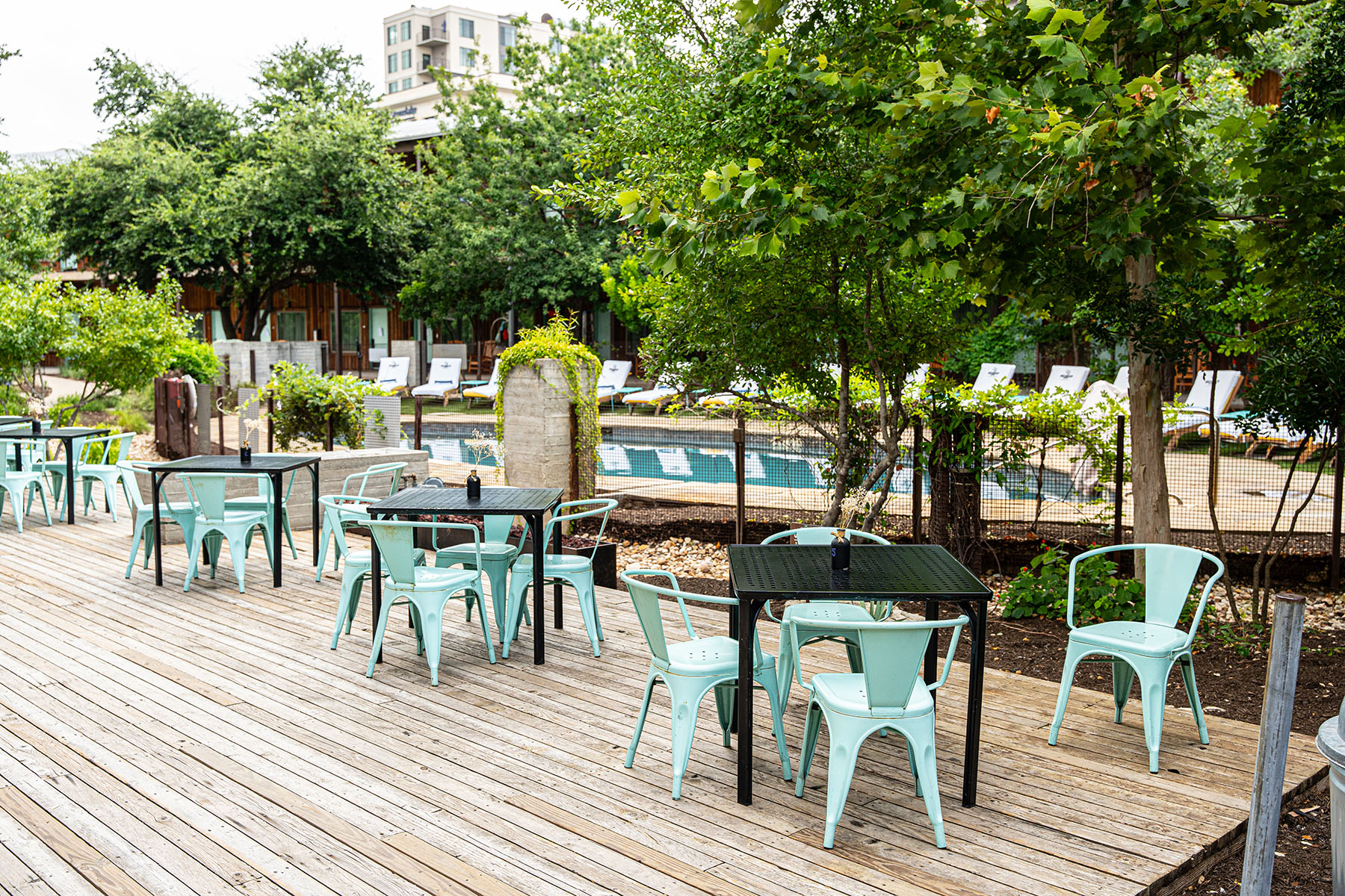 Table, Blue Chairs in courtyard 