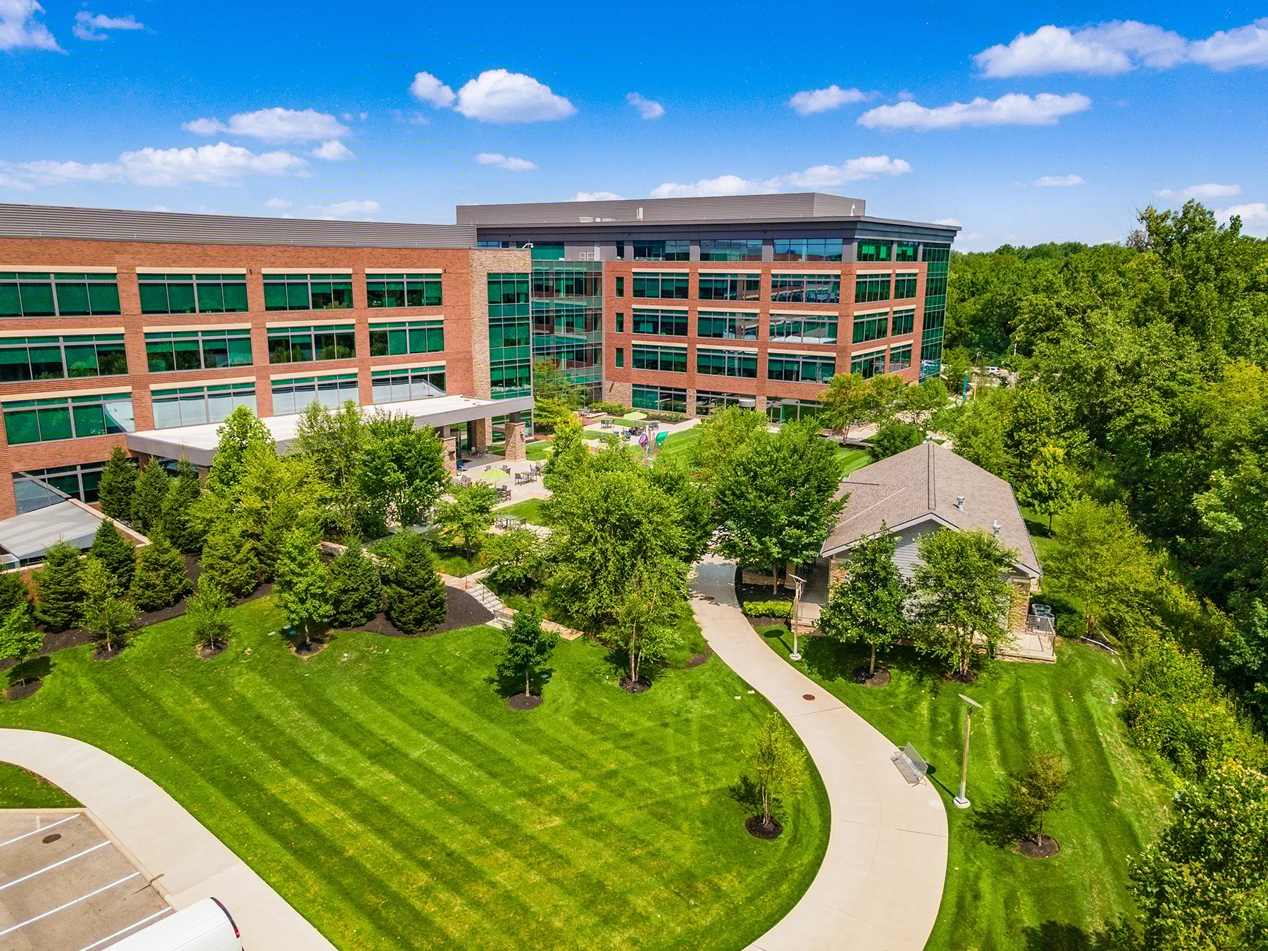 Green turf and trees in front of office. Commercial Landscaping Company in Ohio 
